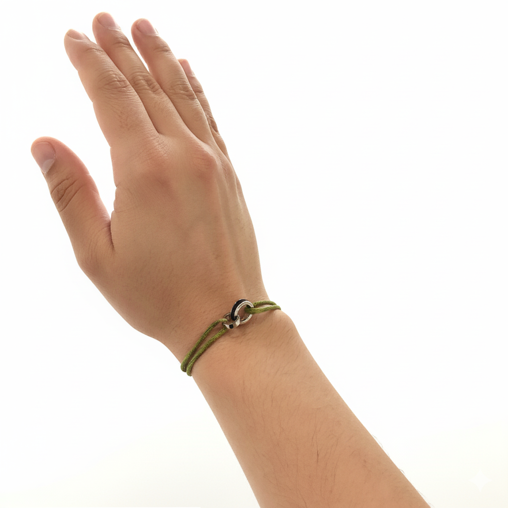 Person wearing a minimalist olive green cord bracelet