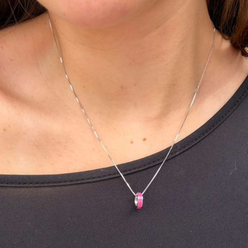 Minimalist sustainable jewelry: dainty silver chain with eco-friendly raspberry charm on a model.
