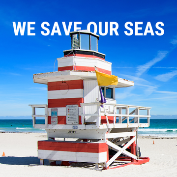 Miami Beach lifeguard stand with 'WE SAVE OUR SEAS' text.