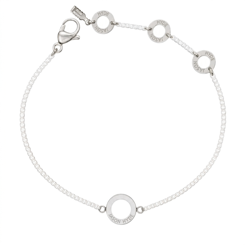 White chain bracelet with matching center disc.