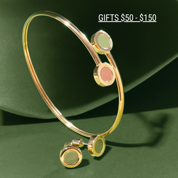 Gifts $50 - $150 Jason Hyde gold bangle and earrings on a green background