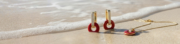 Gold plated necklace and earrings with red enamel, beach